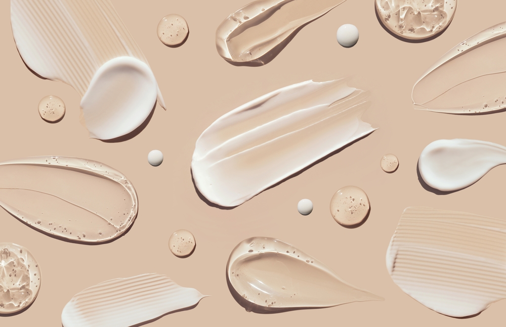 Cosmetic,Smears,Of,Creamy,Texture,On,A,Pastel,Beige,Background